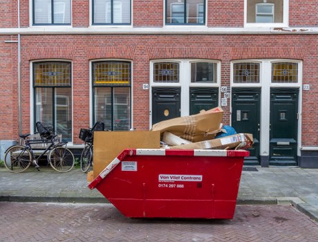 Builders skip container on a construction site in West Ham